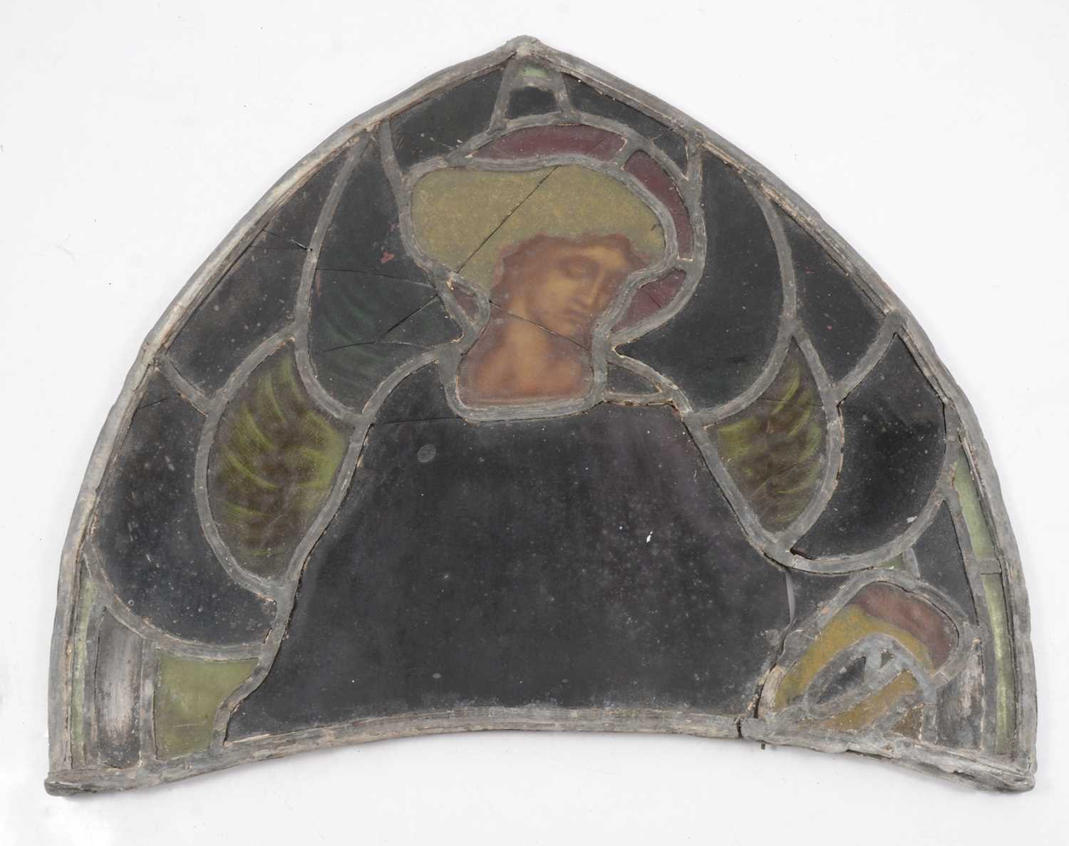 Lot 135 - Arched stained glass fragment, depicting a saint