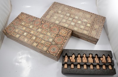 Lot 146 - Two folding inlaid chessboards, and a set of museum replica chess set