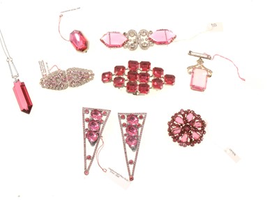 Lot 379 - Eight pink and clear paste dress clips, brooches and buckle.