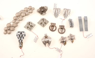 Lot 378 - Thirteen white metal dress clips, brooch and suite, mostly 1930's Czechoslovakian.