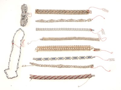 Lot 390 - Nine vintage paste set panel bracelets and another pair making a necklace.