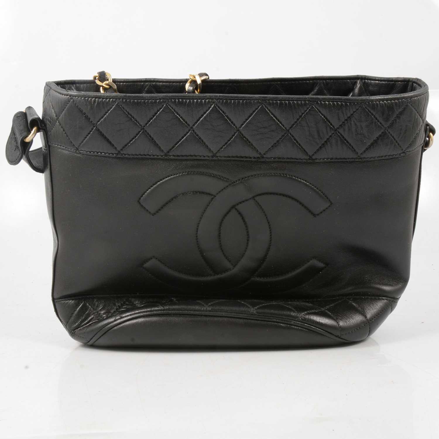 Lot 234 - Chanel - a lady's 1960's vintage black leather handbag.