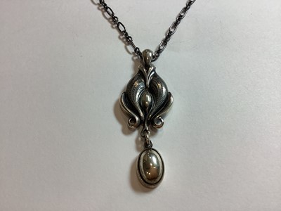 Lot 377 - A Georg Jensen pendant and a Matthew Horner pendant.