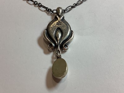Lot 377 - A Georg Jensen pendant and a Matthew Horner pendant.