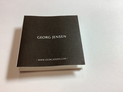 Lot 377 - A Georg Jensen pendant and a Matthew Horner pendant.