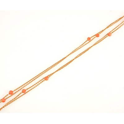 Lot 95 - A yellow metal guard chain set with coral beads with matching earrings.