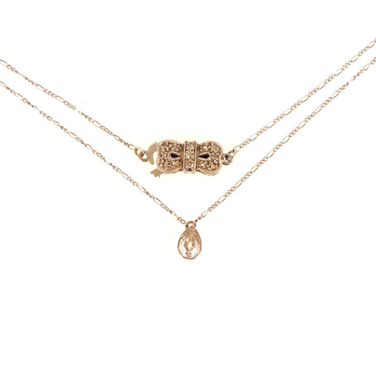Lot 99 - A pear shaped diamond pendant and chain.