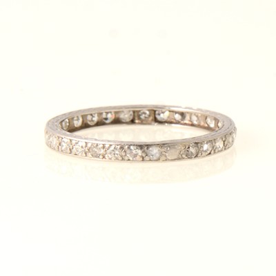 Lot 66 - A diamond full eternity ring.