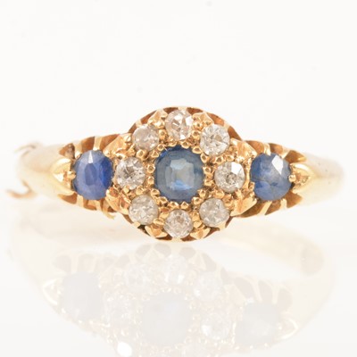 Lot 298 - A sapphire and diamond cluster ring.