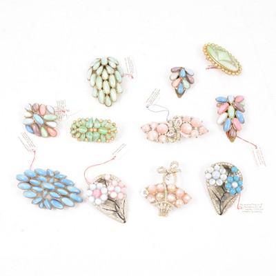 Lot 401 - Eleven vintage satin glass brooches and dress clips.