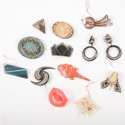 Lot 405 - Twelve vintage celluloid and paste-set millinery flashes, brooches, and earrings.