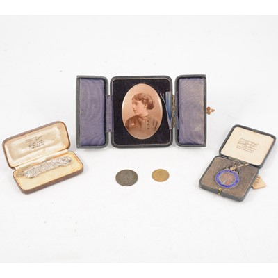 Lot 190 - Photographic portrait miniature, duette paste set dress clip, tokens and silver enamelled medal.