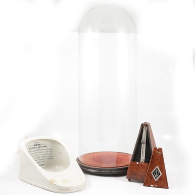 Lot 198 - Glass dome with stand, slipper shape chamber pot, and metronome