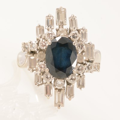 Lot 295 - A contemporary sapphire and diamond cluster ring.