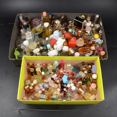 Lot 126 - Two trays of miniature vintage perfume bottles.