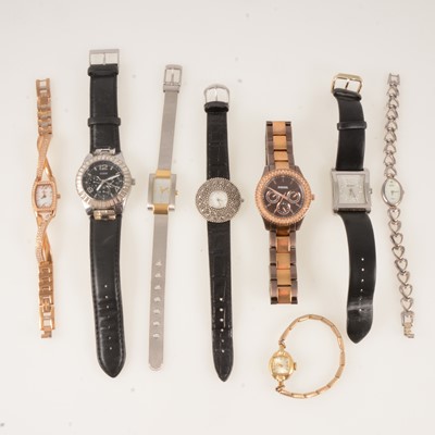 Lot 431 - A collection of lady's fashion watches, silver Pulsar, Fossil, Guess DKNY.