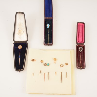 Lot 374 - Three stick pins in boxes and seven other small pins.