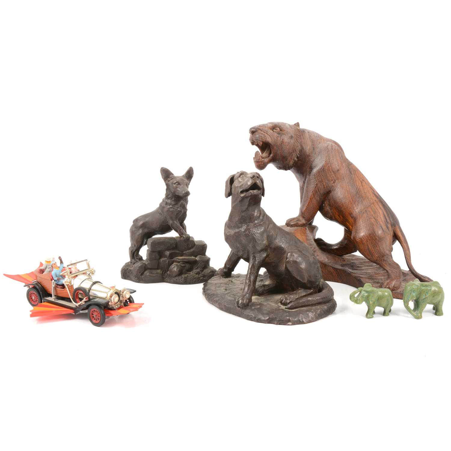 Lot 83 - Two bronzed resin figures of dogs, a carved tiger, etc