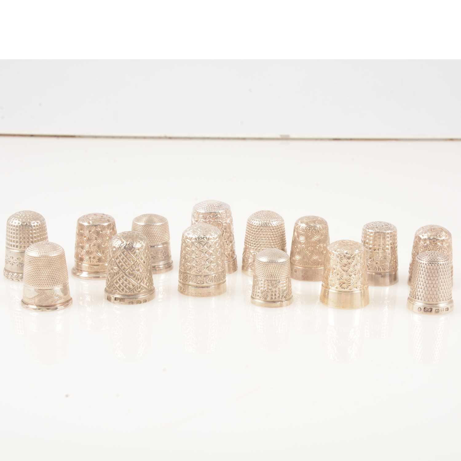 Lot 229 - Fourteen Victorian and later silver thimbles, to include Charles Horner and Marion & Co.
