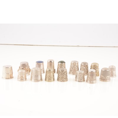 Lot 148 - Sixteen silver and white metal thimbles.
