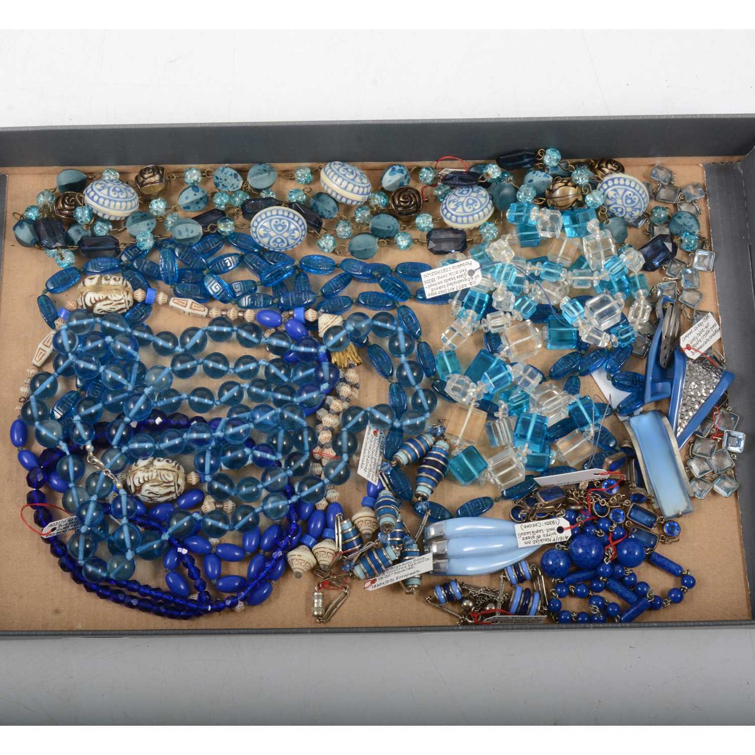 Lot 399 - One tray of vintage glass, bakelite and celluloid jewellery with a blue tone.