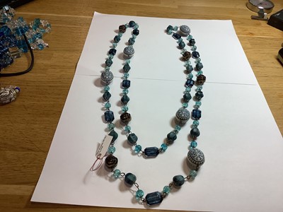 Lot 399 - One tray of vintage glass, bakelite and celluloid jewellery with a blue tone.