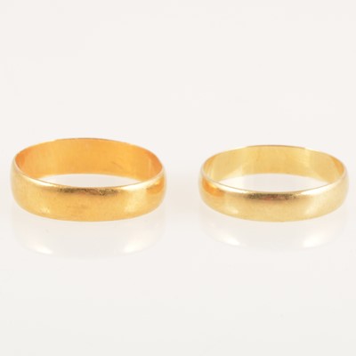 Lot 245 - Two gold wedding bands, 22 carat and 18 carat.