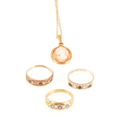 Lot 261 - Three gemset rings and a cameo pendant and chain.