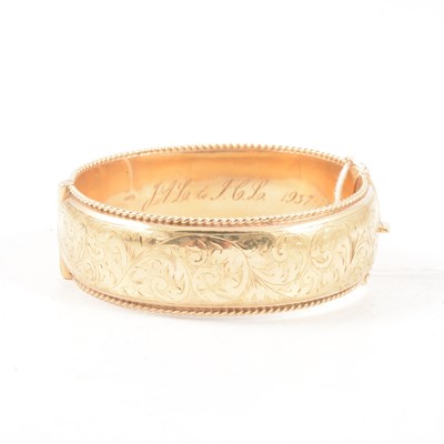 Lot 351 - A 9 carat yellow gold Victorian style half hinged bangle.