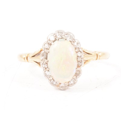 Lot 304 - An opal and diamond cluster ring.