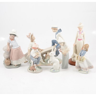 Lot 25 - Six Lladro porcelain figures and a Spanish figure of an Edwardian lady