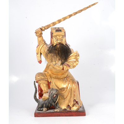 Lot 19 - Chinese gilt and lacquered figure of a bearded warrior