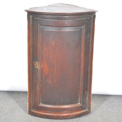 Lot 329 - George III oak cylinder front hanging corner cupboard