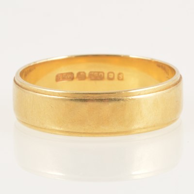 Lot 242 - An 18 carat yellow gold wedding band.