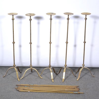 Lot 497 - Set of five tall pricket candlesticks, fender and brass stair rods