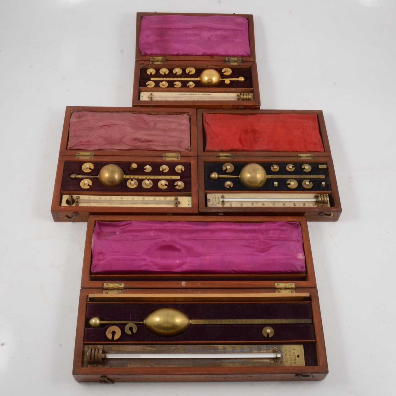 Lot 100 - Three Hydrometers and a Saccharometer, cased