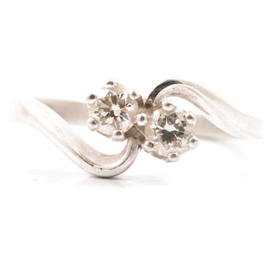 Lot 7 - A diamond two stone crossover ring.