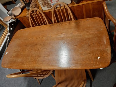 Lot 489 - Ercol dining table and chairs