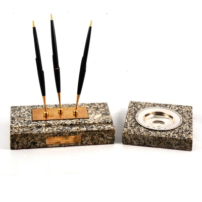 Lot 124 - Silver ashtray and brass pen holder, both mounted in granite from London Bridge.