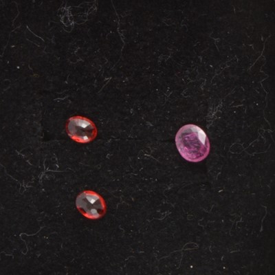 Lot 269 - Gem Collector - Three loose, faceted rubies.