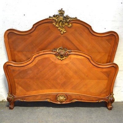 Lot 579 - French walnut and gilt kingsize bed