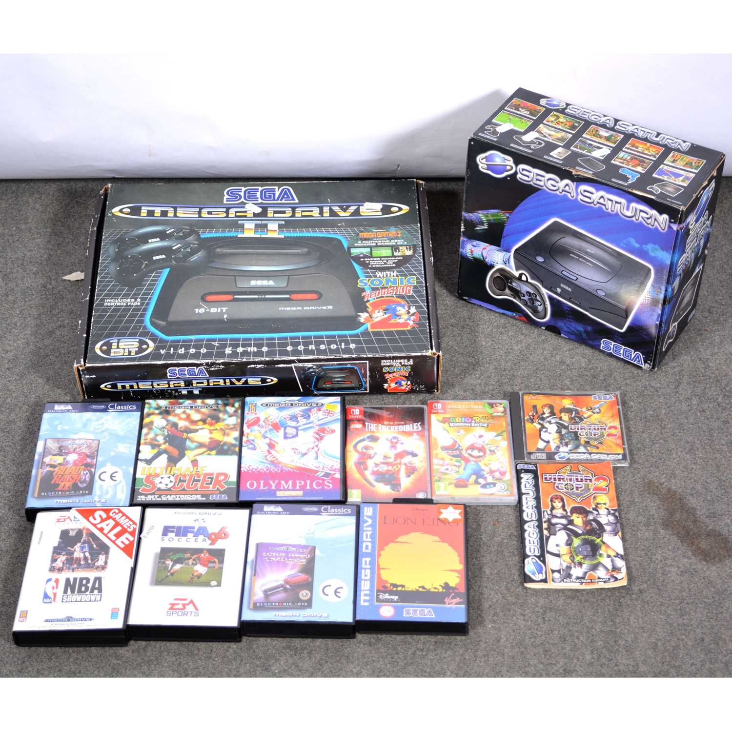 Lot 198 - Vintage games consoles, two including Sega Saturn and Sega Megadrive II