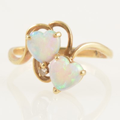 Lot 240 - A crossover ring set with two heart shaped opals.