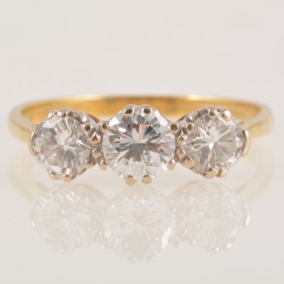 Lot 225 - A diamond three stone ring.