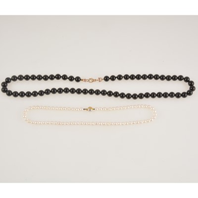 Lot 360 - A non-graduated cultured pearl necklace and a black bead necklace.