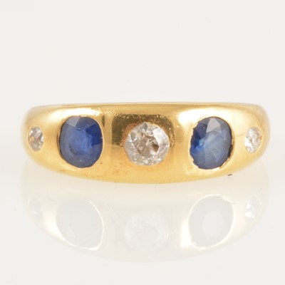 Lot 234 - A sapphire and diamond roman set ring.