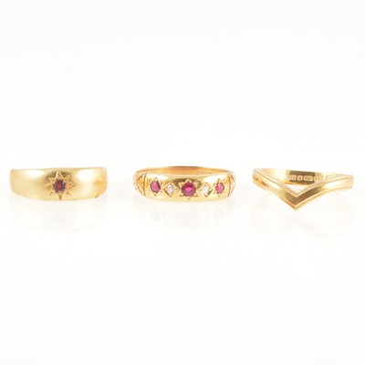 Lot 244 - An 18 carat gold wishbone ring and two gemset rings.