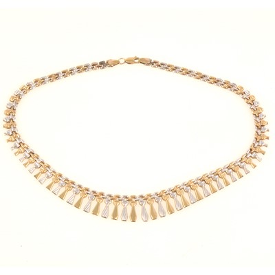 Lot 273 - A 9 carat yellow and white gold fringe necklace.