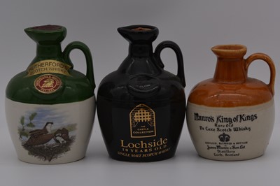 Lot 122 - Four Rutherford's 12 year old ceramic decanters, and two others