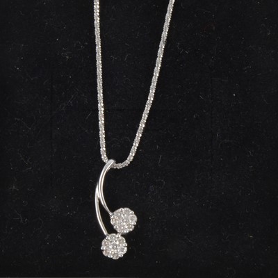 Lot 276 - A diamond cluster pendant and chain.